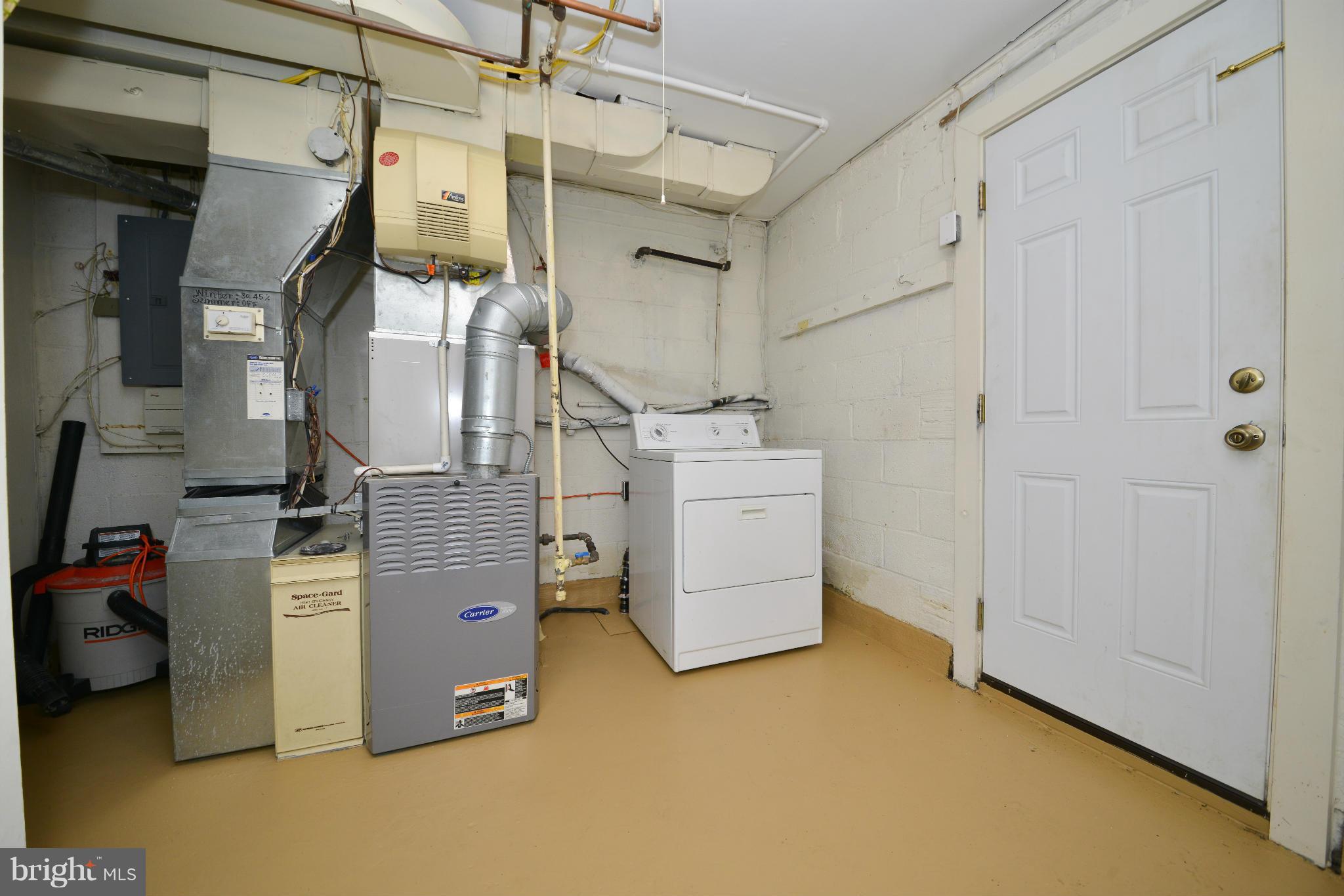 6902 Highland Street Springfield, VA 22150 - Photo 18 of 24 a view of a storage & utility room with racks