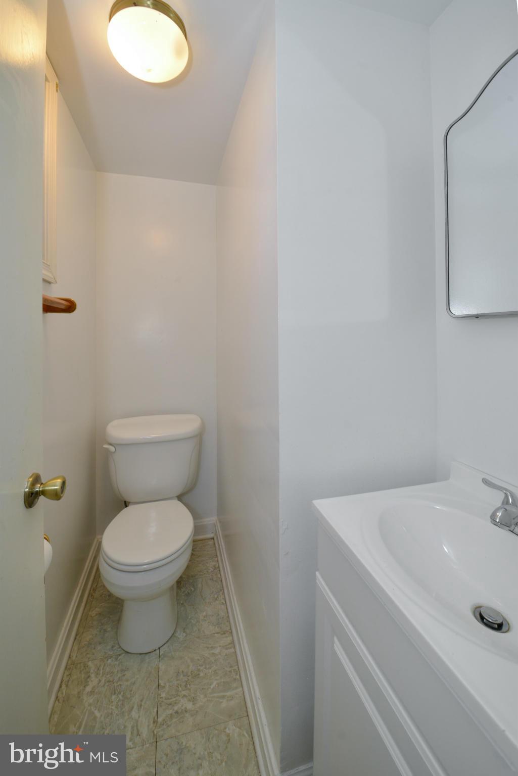 6902 Highland Street Springfield, VA 22150 - Photo 20 of 24 a bathroom with a sink and a toilet