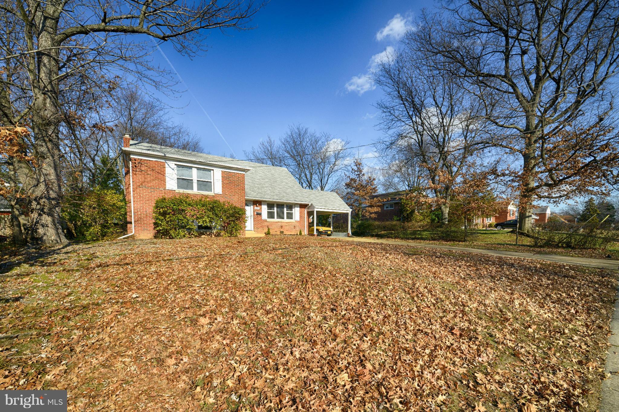 6902 Highland Street Springfield, VA 22150 - Photo 3 of 24 a front view of a house with a yard