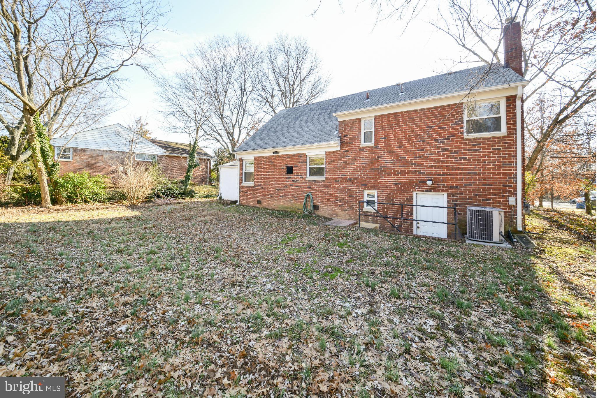 6902 Highland Street Springfield, VA 22150 - Photo 22 of 24 a view of a house with a yard