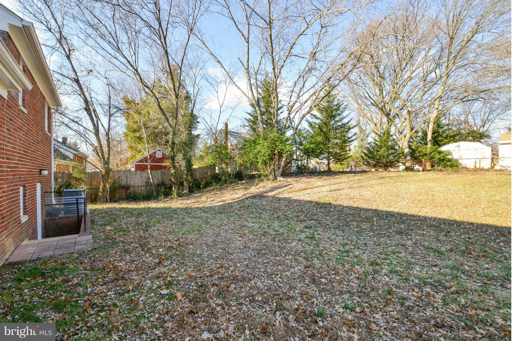 6902 Highland Street Springfield, VA 22150 - Photo 24 of 24 a view of a yard with an trees