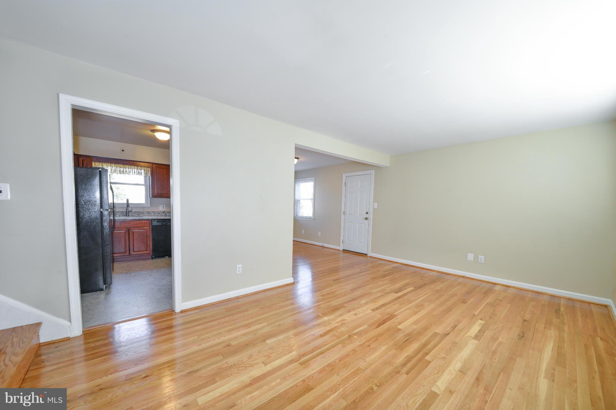 6902 Highland Street Springfield, VA 22150 - Photo 4 of 24 a view of an empty room and wooden floor