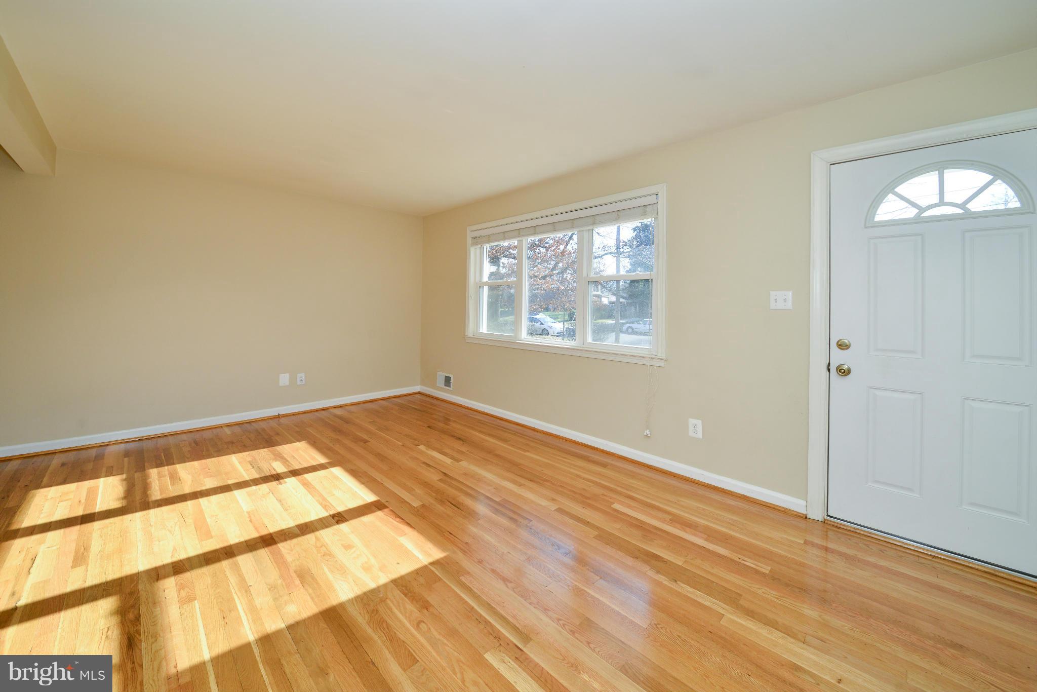 6902 Highland Street Springfield, VA 22150 - Photo 5 of 24 a view of empty room with wooden floor and fan