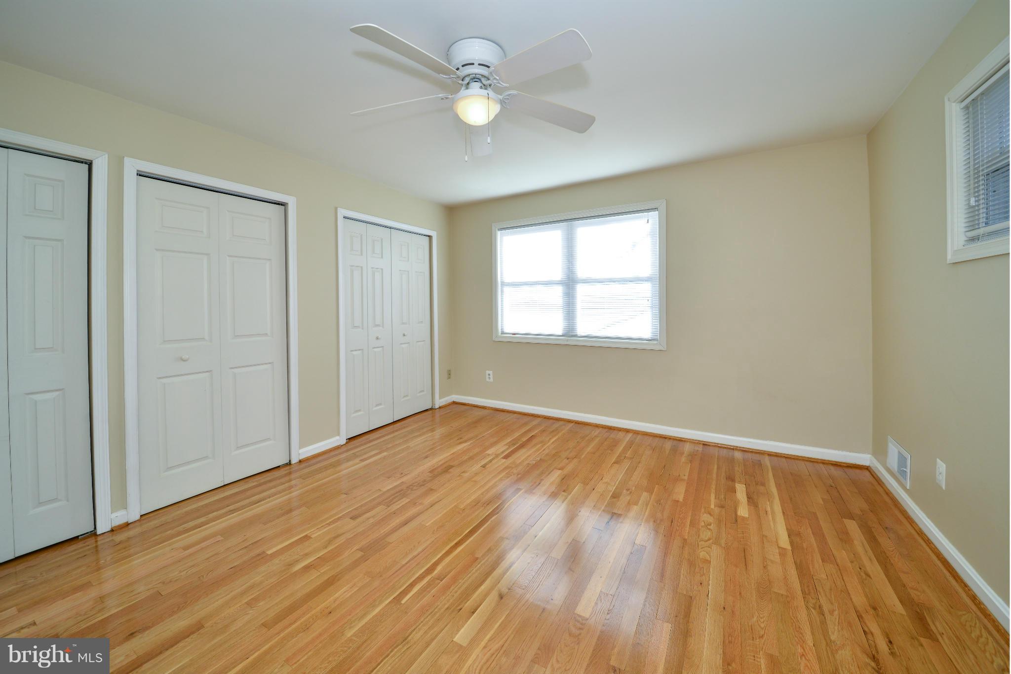6902 Highland Street Springfield, VA 22150 - Photo 10 of 24 wooden floor in an empty room with a window