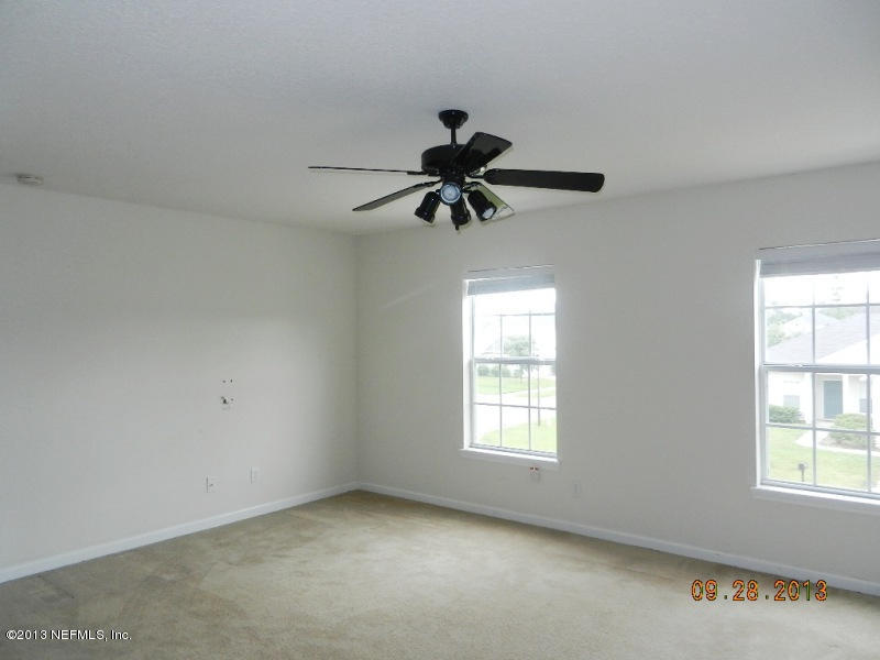 7278 Rampart Ridge Circle South Jacksonville, FL 32244 - Photo 6 of 14 a window in an empty room