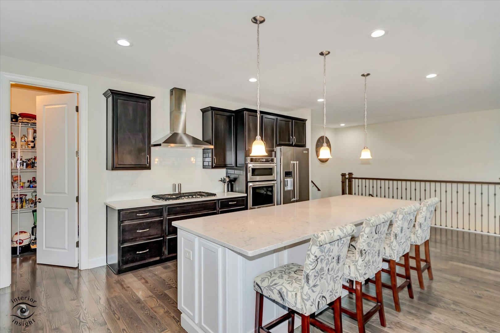 318 Arabian Circle Willowbrook, IL 60527 - Photo 12 of 37 a kitchen with stainless steel appliances kitchen island granite countertop a stove a sink a refrigerator and chairs