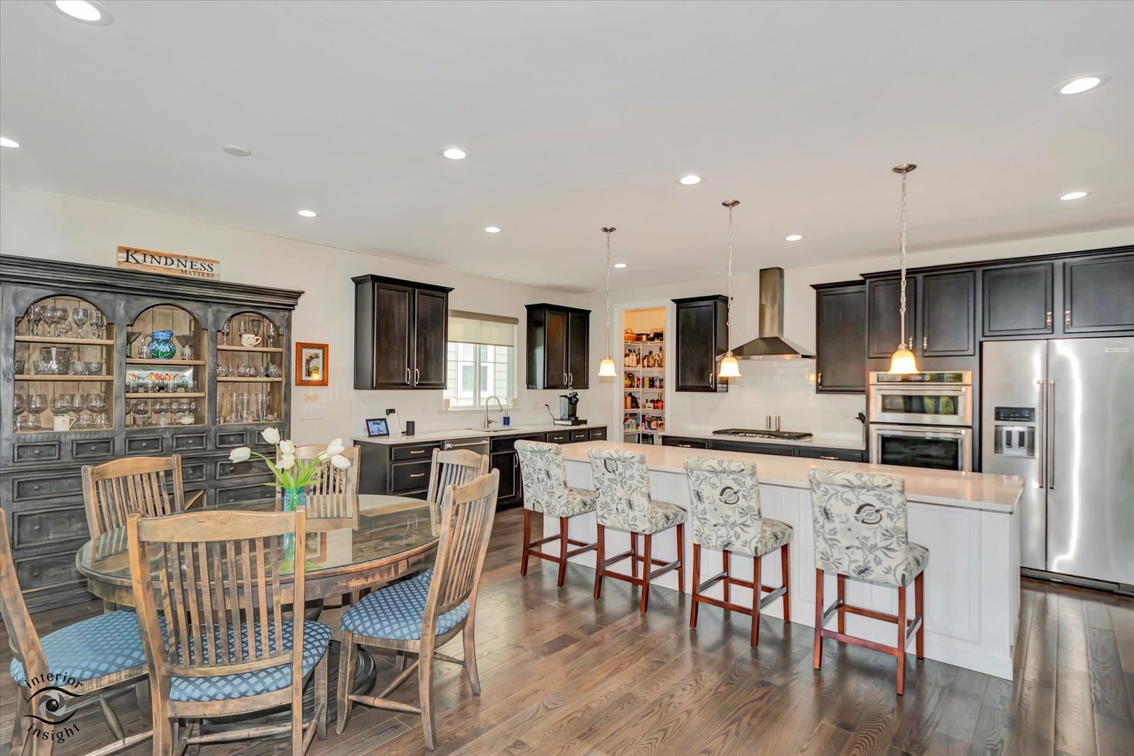 318 Arabian Circle Willowbrook, IL 60527 - Photo 13 of 37 a view of a dining room with furniture wooden floor and kitchen view