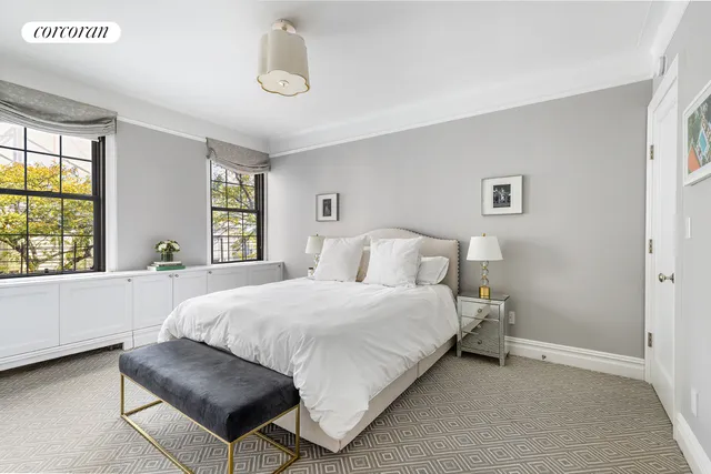 a kitchen with cabinets appliances and a window