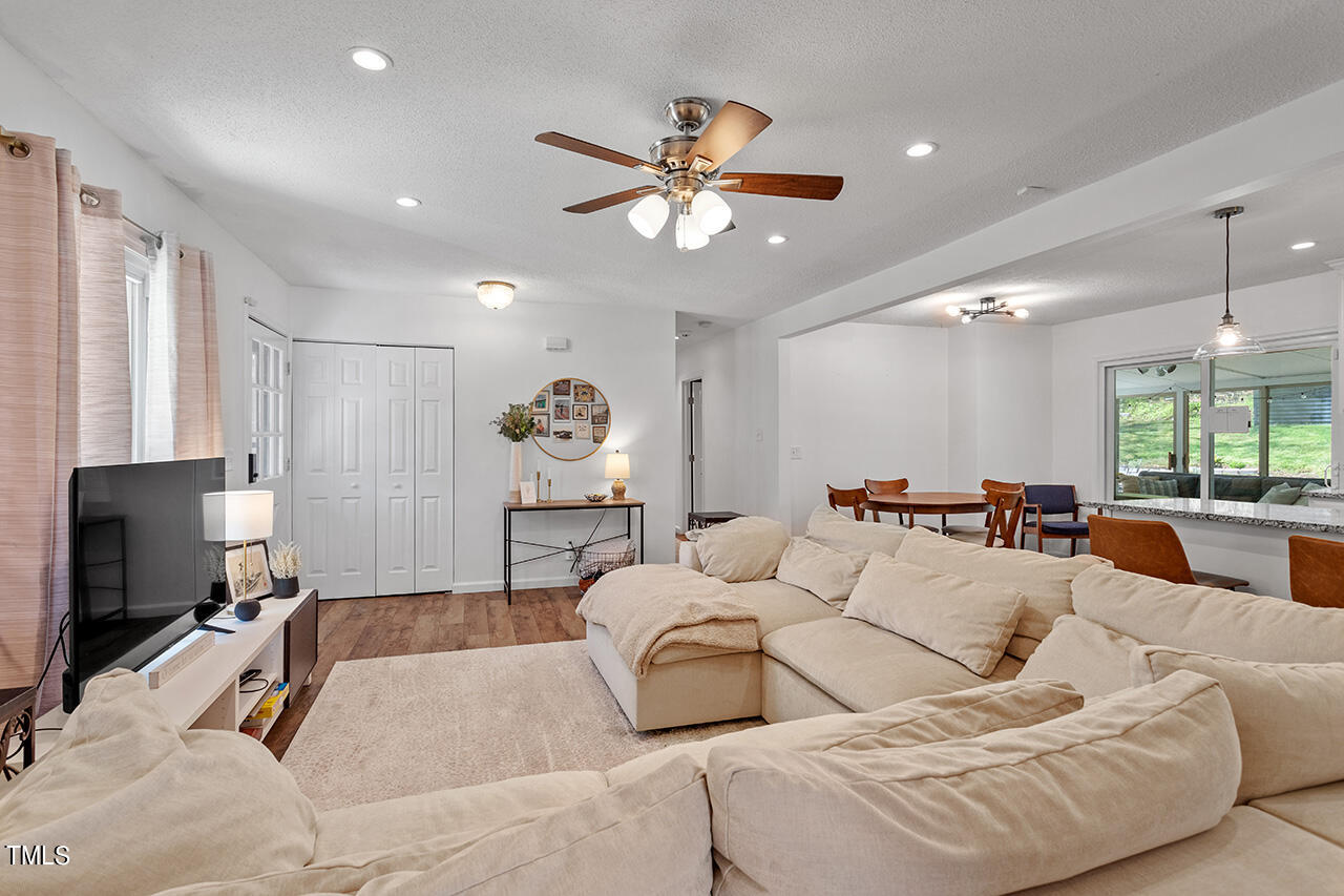 2220 Foxtrot Road Raleigh, NC 27610 - Photo 12 of 24 a living room with furniture and a flat screen tv