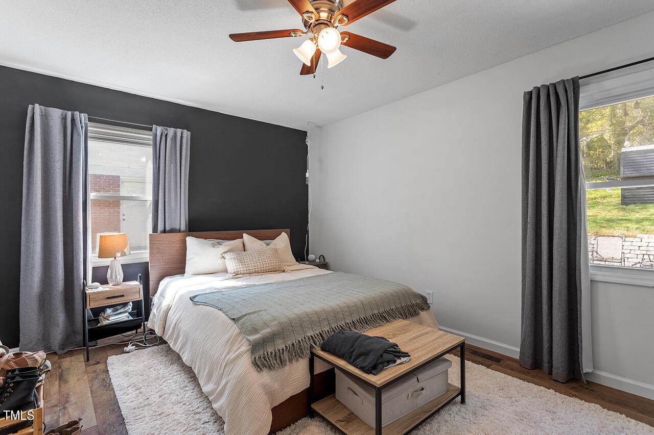 2220 Foxtrot Road Raleigh, NC 27610 - Photo 14 of 24 a bedroom with a bed and window