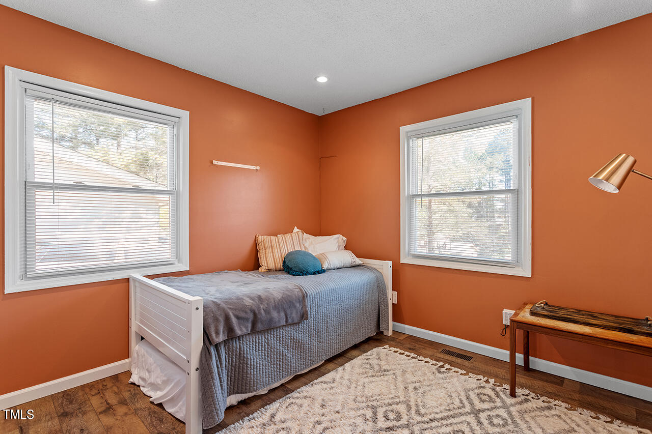2220 Foxtrot Road Raleigh, NC 27610 - Photo 19 of 24 a bedroom with a bed and a window