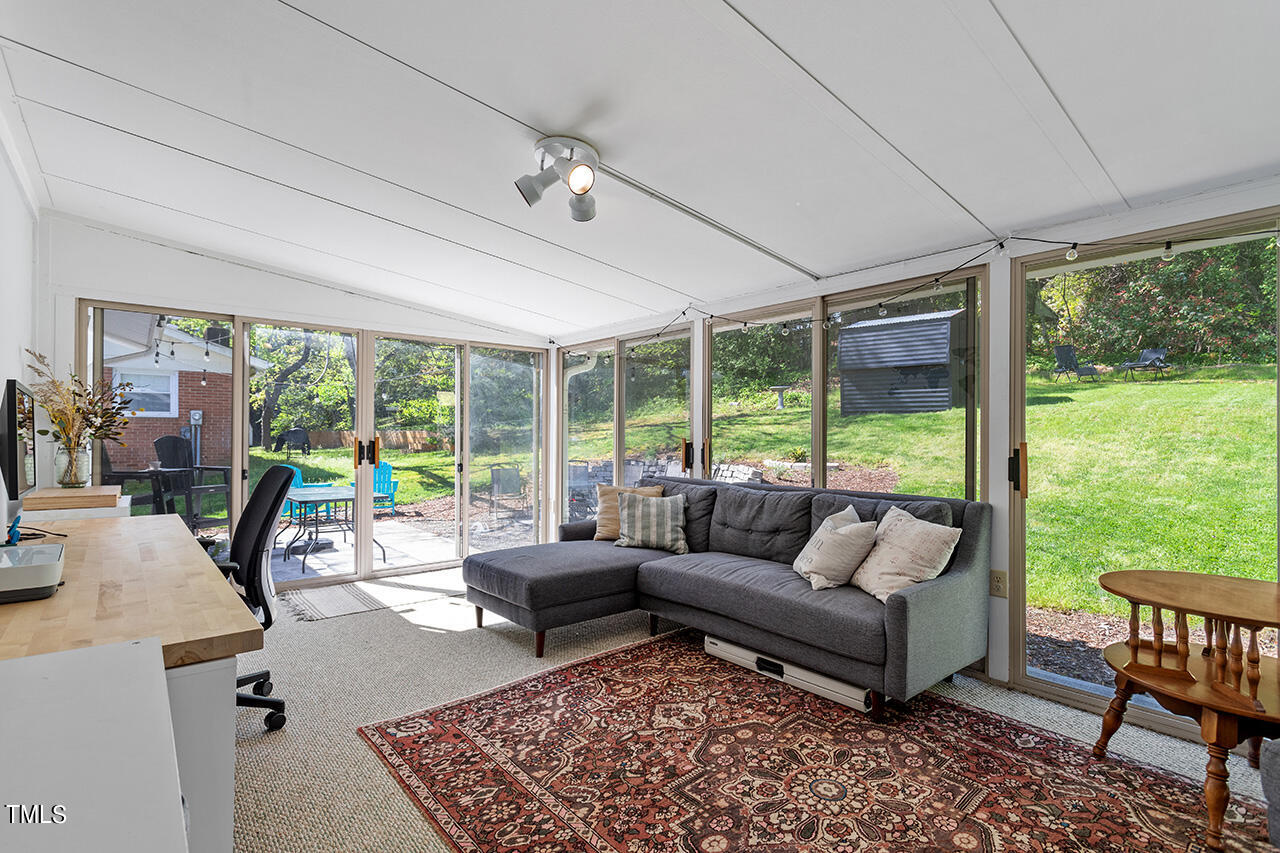 2220 Foxtrot Road Raleigh, NC 27610 - Photo 22 of 24 a living room with furniture and large windows