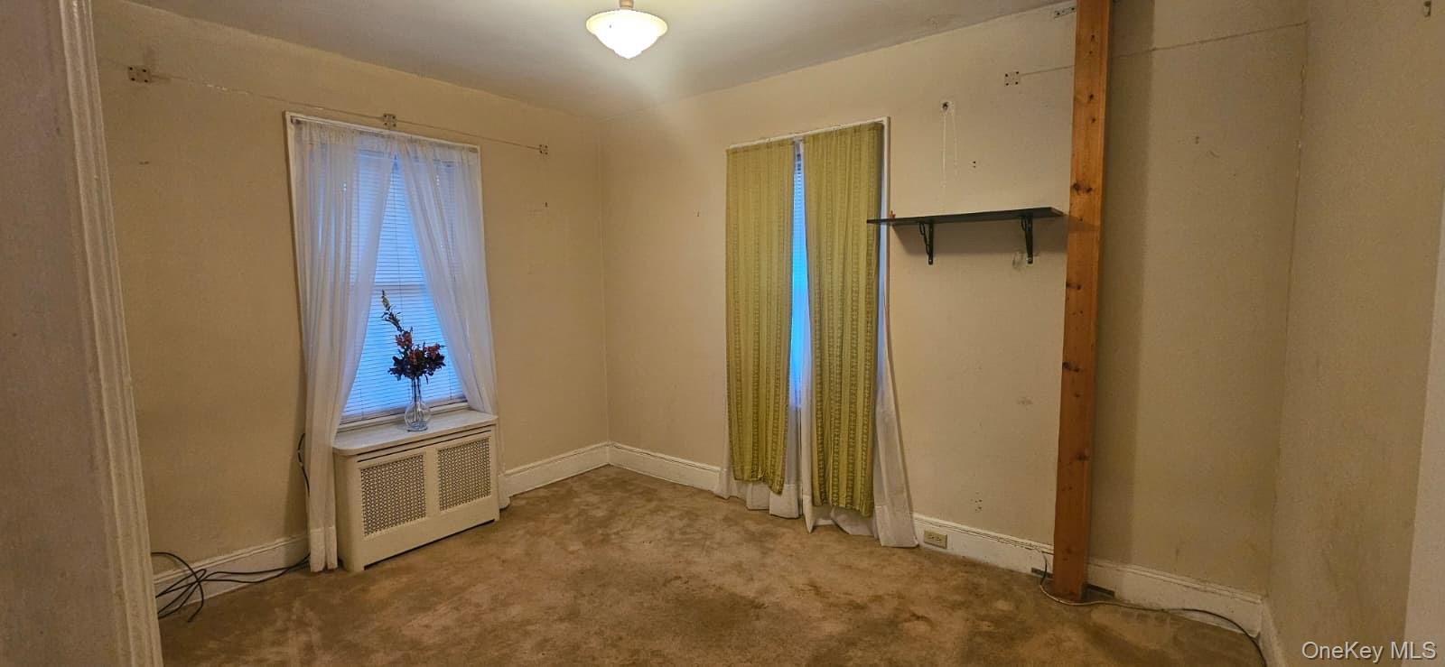 138-39 227th Street Queens, NY 11413 - Photo 11 of 25 a view of a hallway to rooms