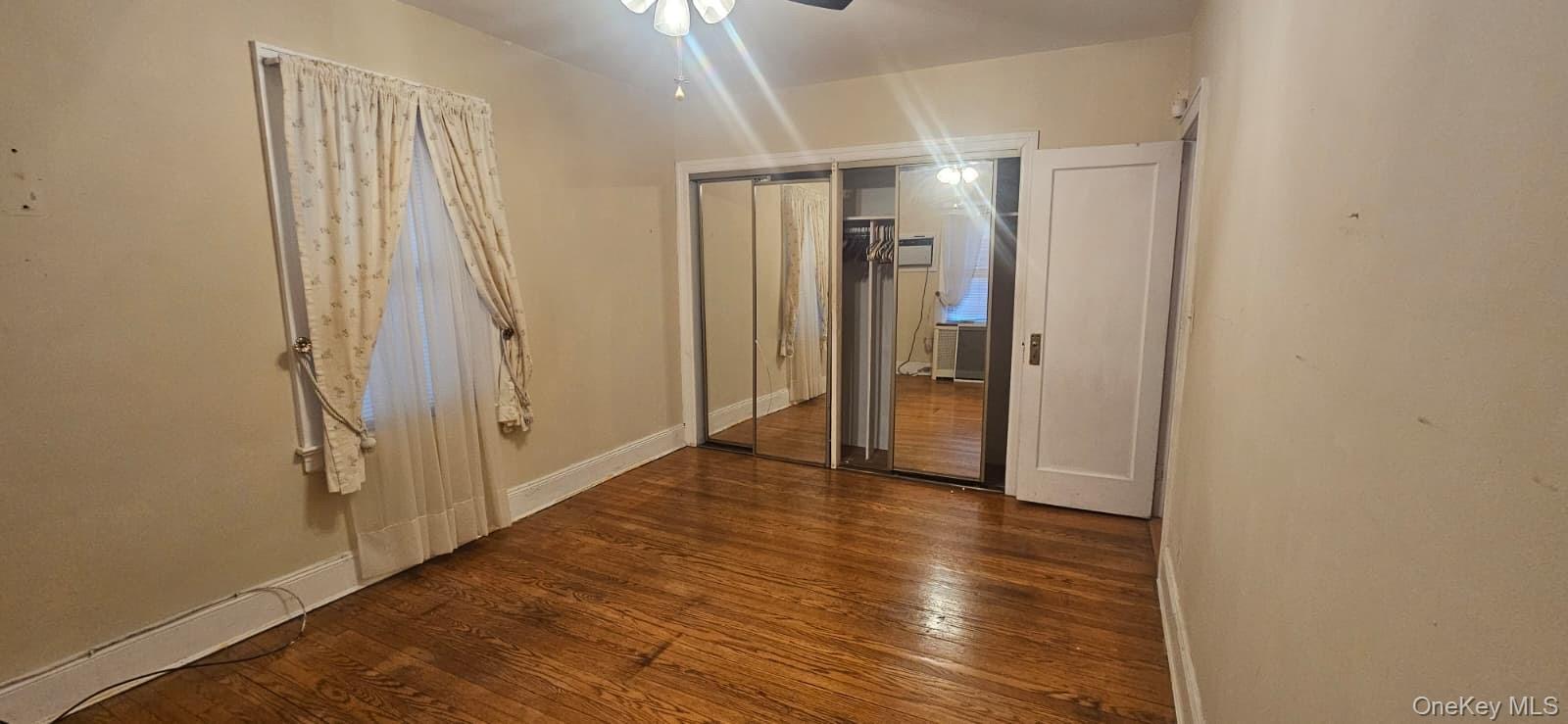 138-39 227th Street Queens, NY 11413 - Photo 10 of 25 a view of entryway with wooden floor