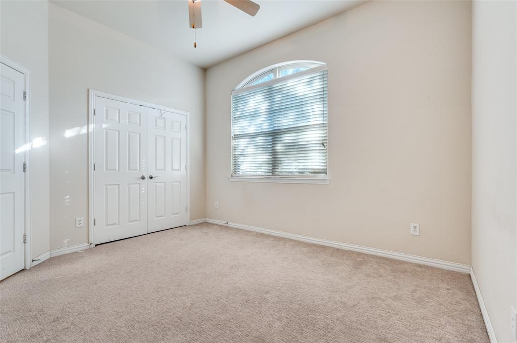 1905 Lantana Lane Irving, TX 75063 - Photo 11 of 21 an empty room with windows and closet