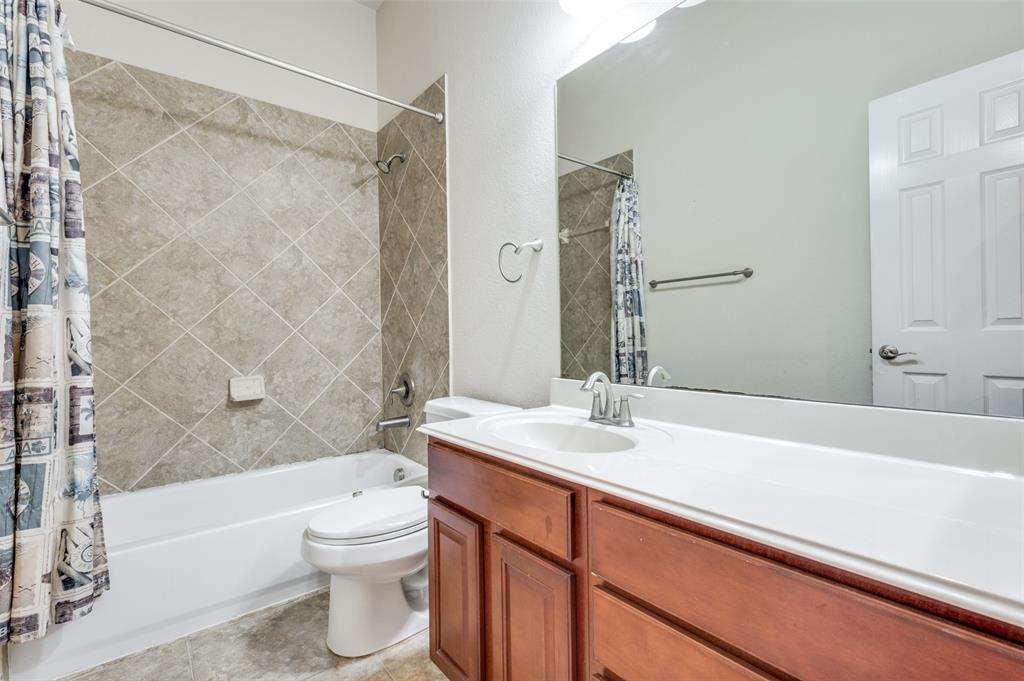 1905 Lantana Lane Irving, TX 75063 - Photo 12 of 21 a bathroom with a sink a toilet and a bathtub