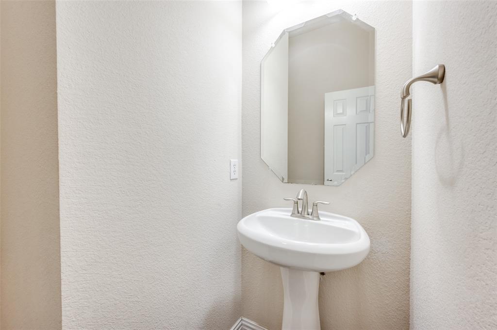 1905 Lantana Lane Irving, TX 75063 - Photo 15 of 21 a bathroom with a sink and a mirror