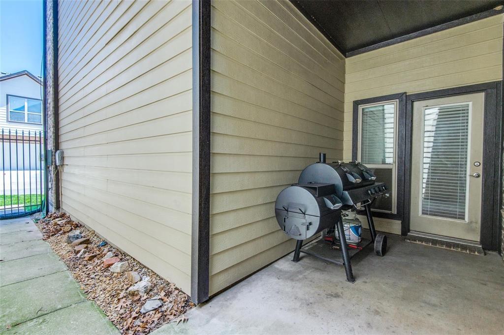 1905 Lantana Lane Irving, TX 75063 - Photo 17 of 21 a view of a wooden door with a bench in patio