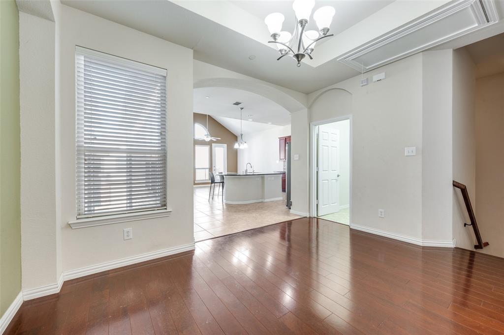 1905 Lantana Lane Irving, TX 75063 - Photo 21 of 21 a view of an empty room with wooden floor and a window