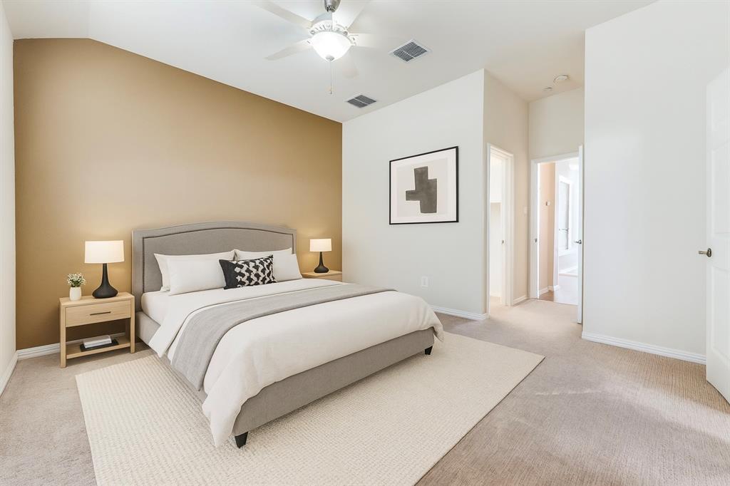1905 Lantana Lane Irving, TX 75063 - Photo 6 of 21 a bedroom with a bed and a chandelier