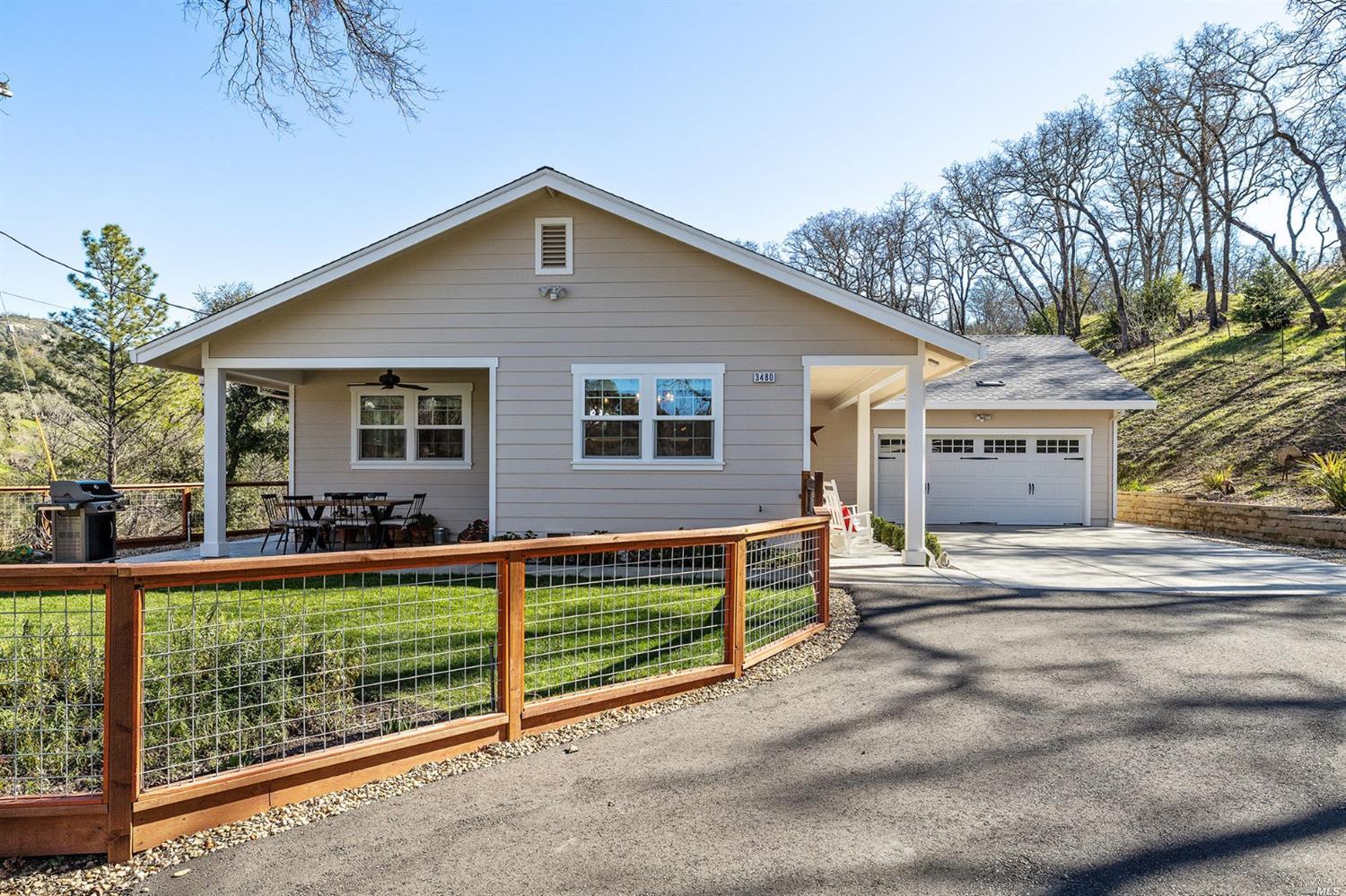 3480 Porter Creek Road Santa Rosa, CA 95404 - Photo 1 of 1 a front view of a house with a yard and garage