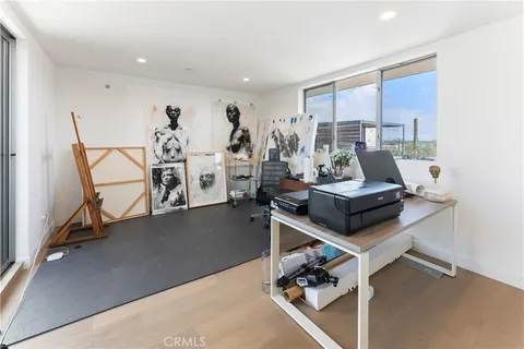 a view of a livingroom with furniture and a window