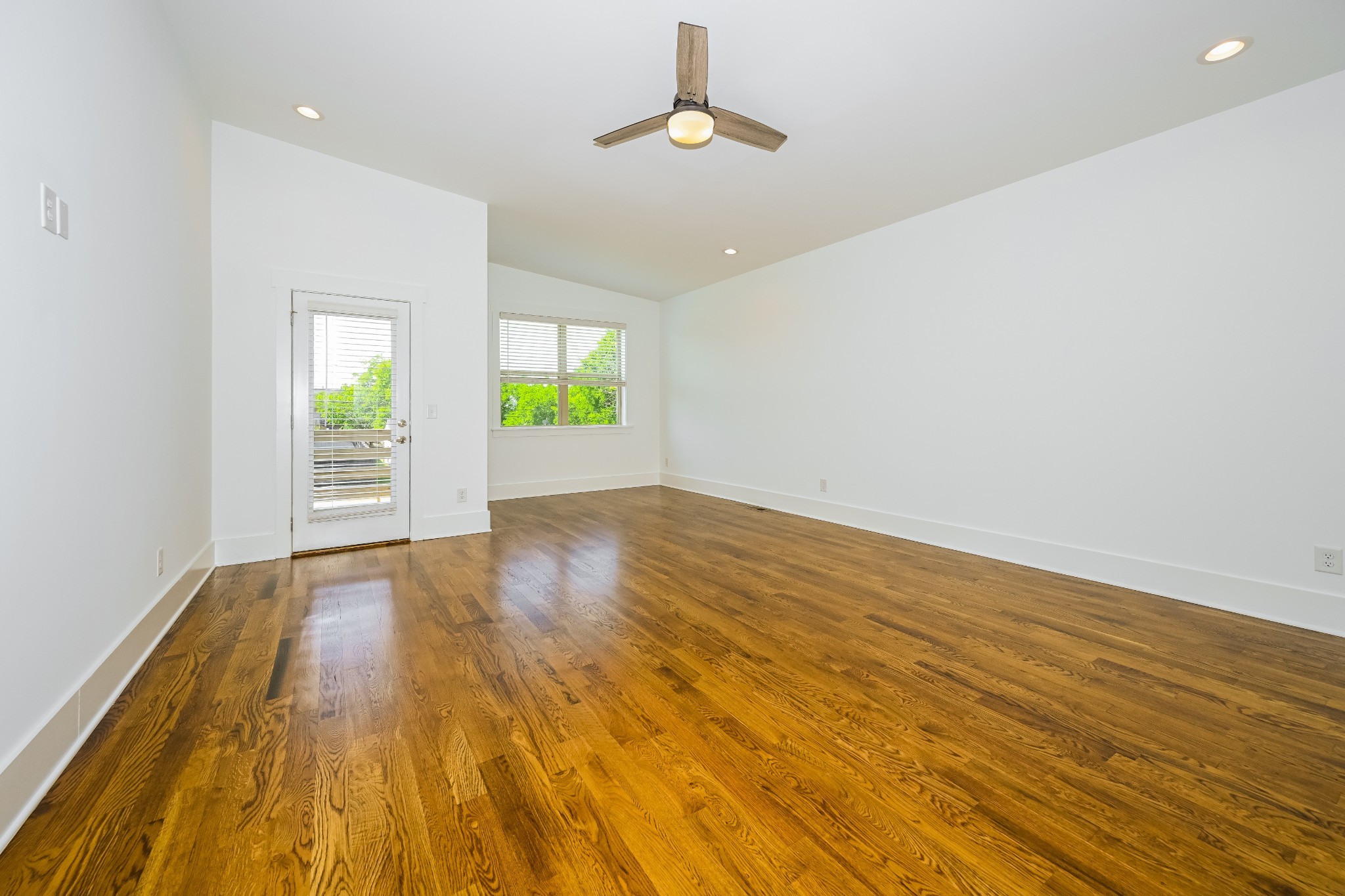 341 Edwin Street, Unit B Nashville, TN 37207 - Photo 14 of 17 wooden floor in an empty room with a window