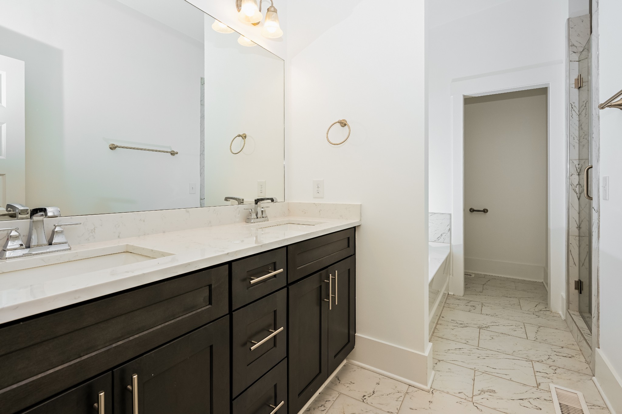 341 Edwin Street, Unit B Nashville, TN 37207 - Photo 3 of 17 a bathroom with a double vanity sink a and mirror