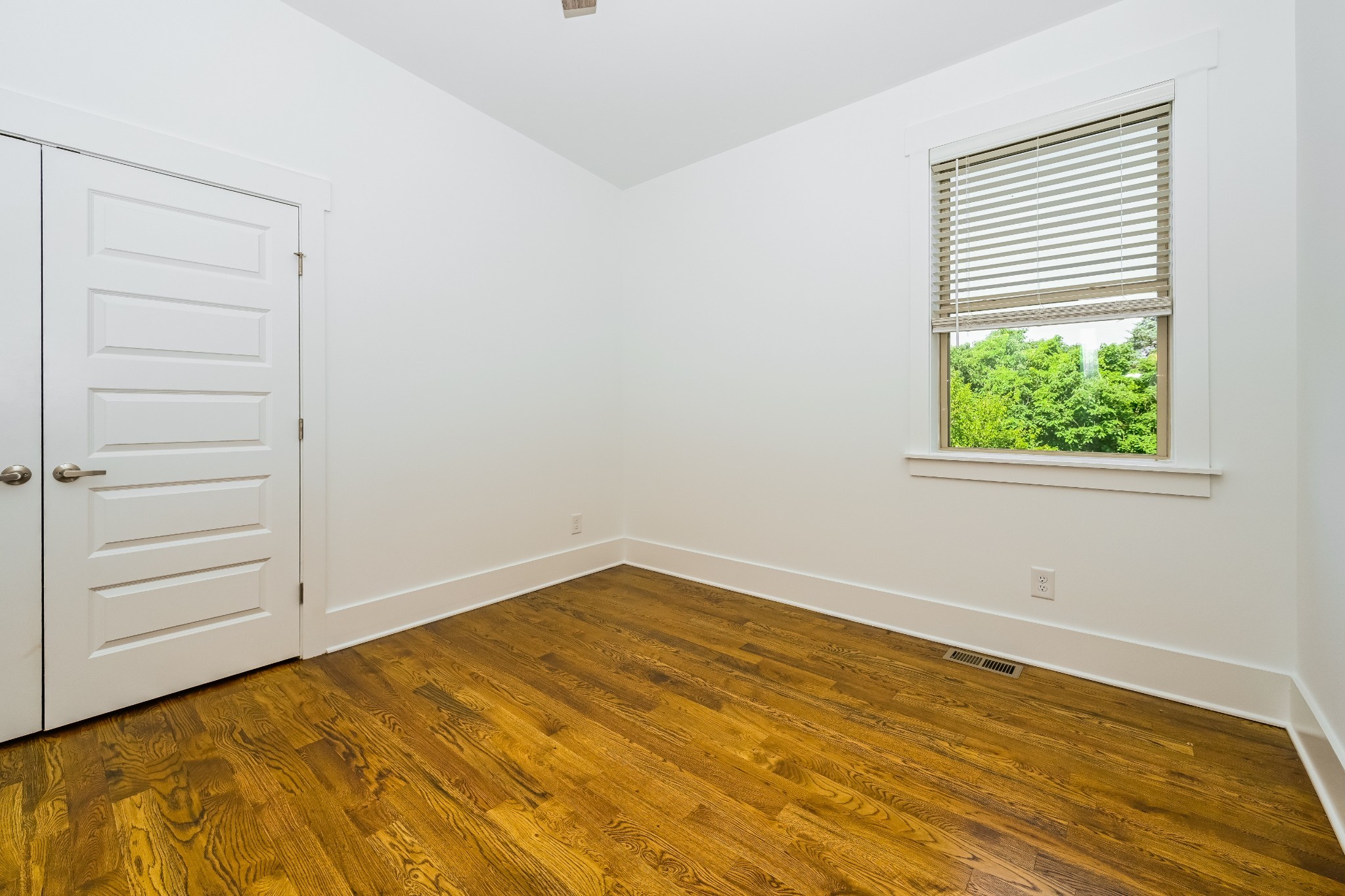 341 Edwin Street, Unit B Nashville, TN 37207 - Photo 5 of 17 a view of empty room with wooden floor