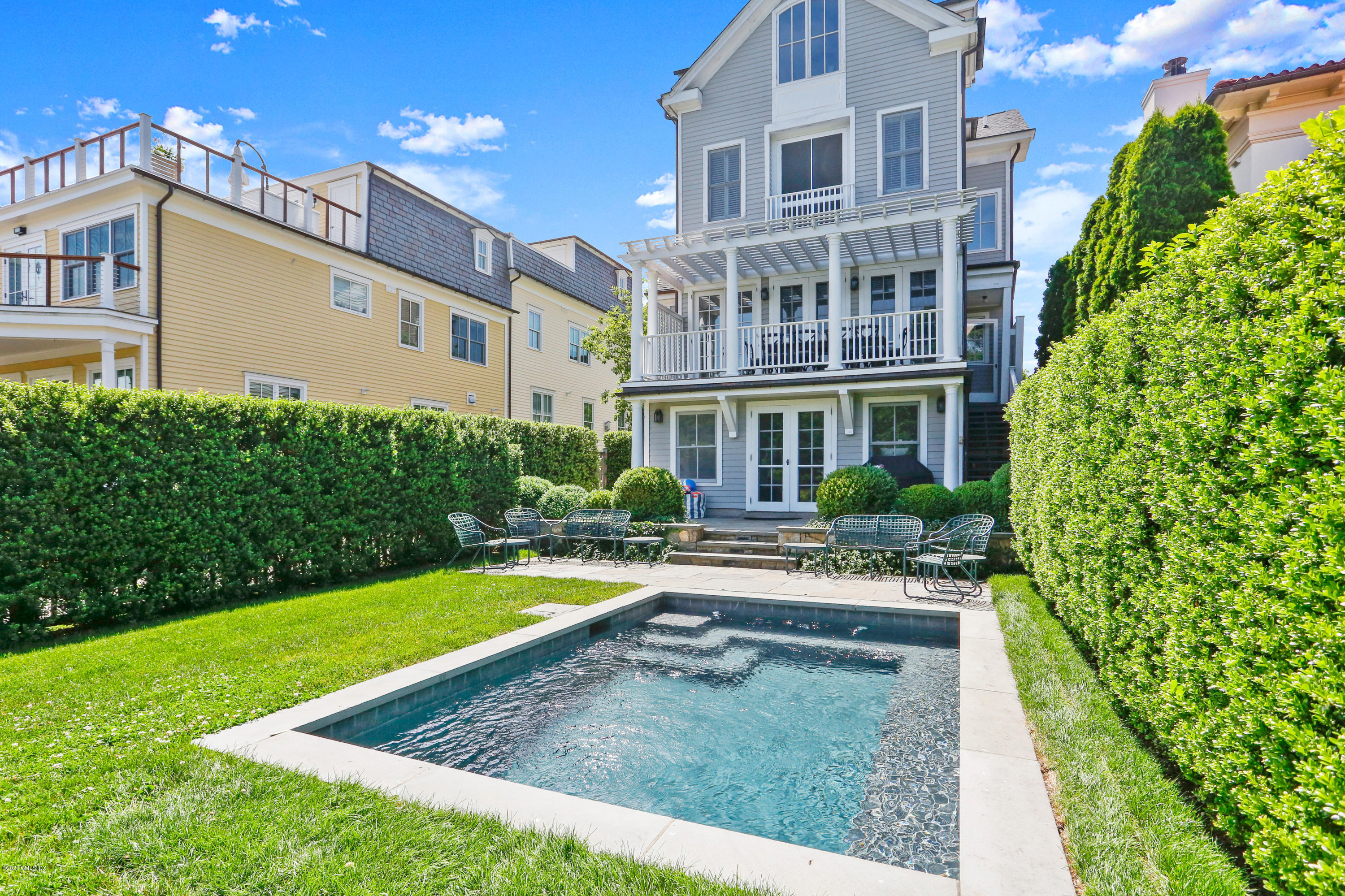 619 Steamboat Road Greenwich, CT 06830 - Photo 1 of 27 a view of an house with swimming pool garden and patio