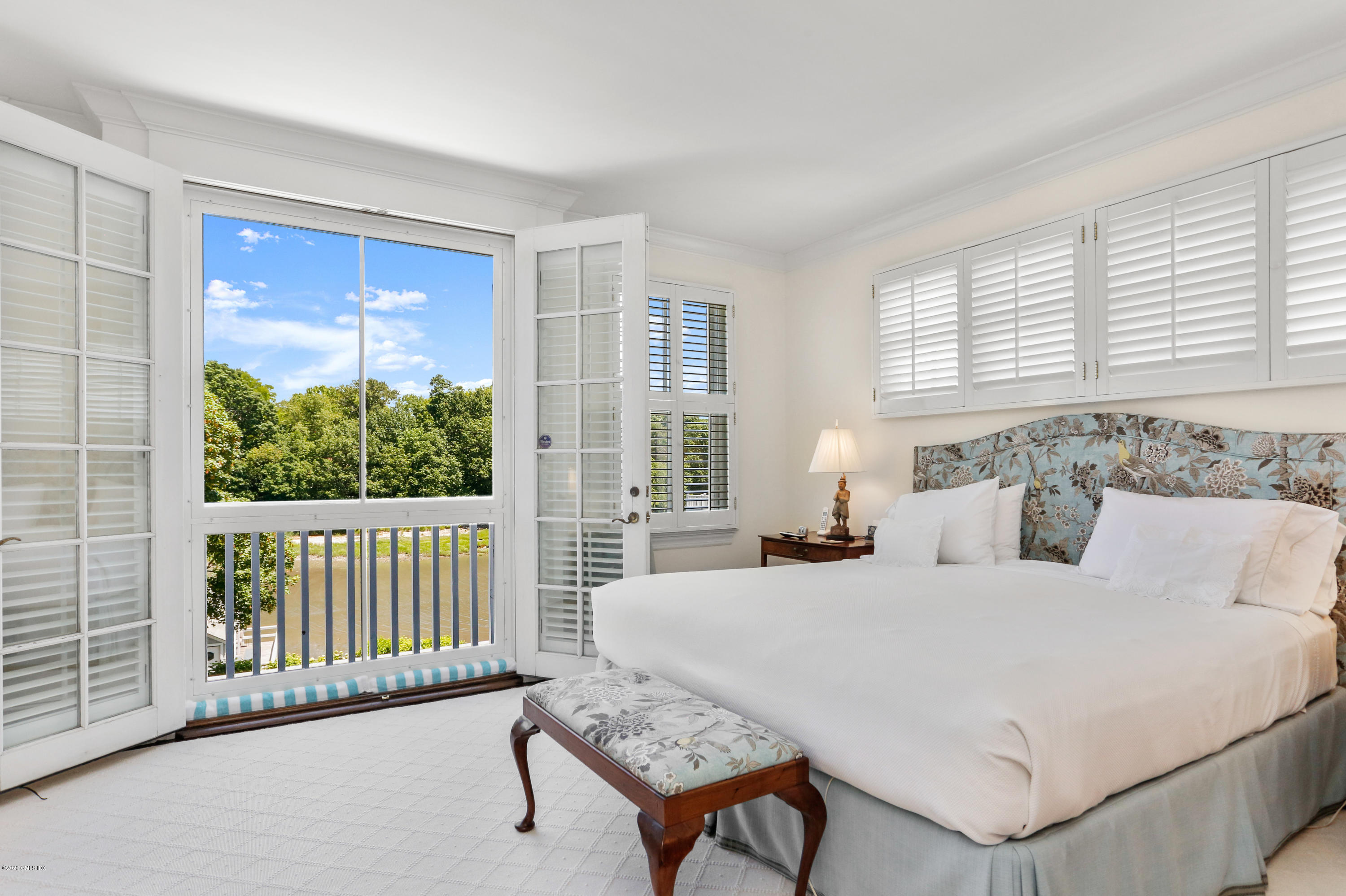619 Steamboat Road Greenwich, CT 06830 - Photo 11 of 27 a bedroom with a bed and a large window