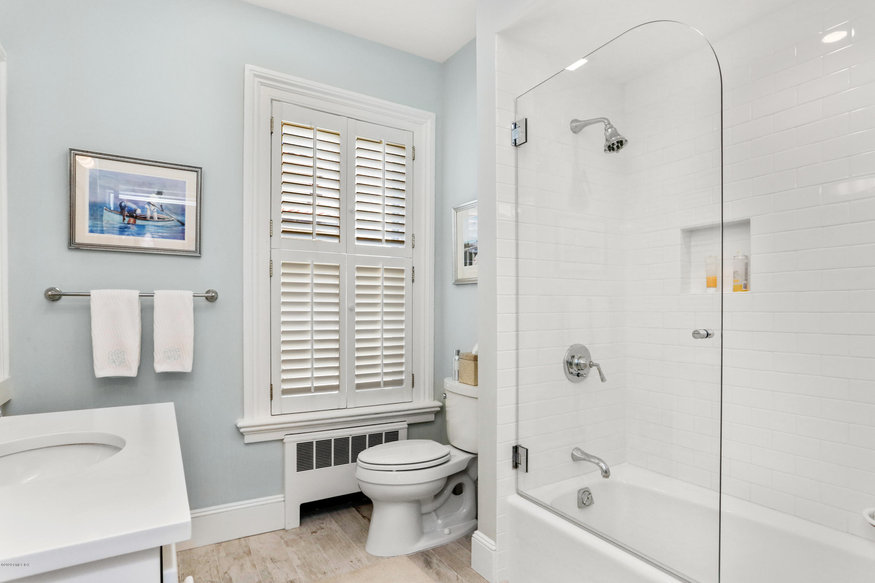 619 Steamboat Road Greenwich, CT 06830 - Photo 13 of 27 a bathroom with a bathtub shower sink vanity and toilet