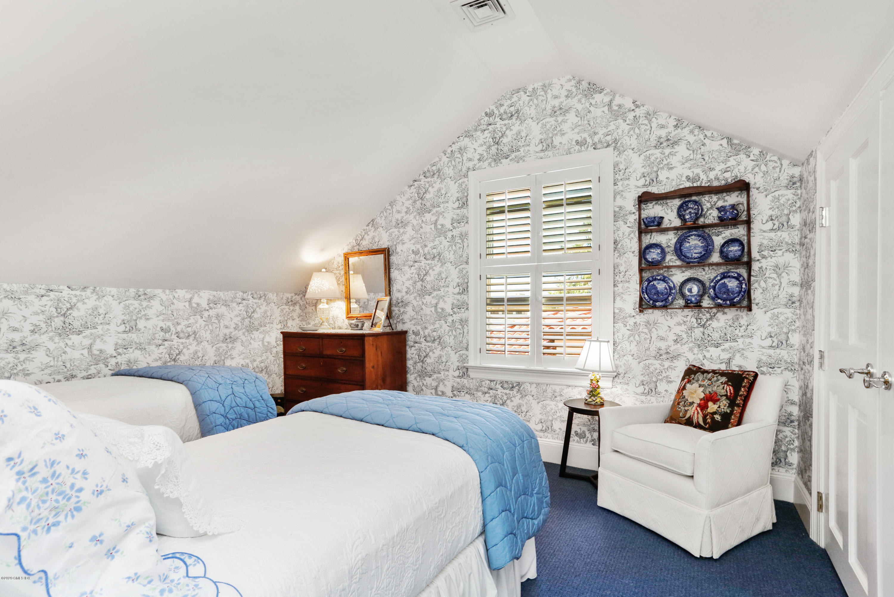 619 Steamboat Road Greenwich, CT 06830 - Photo 14 of 27 a bedroom with a bed and a couch
