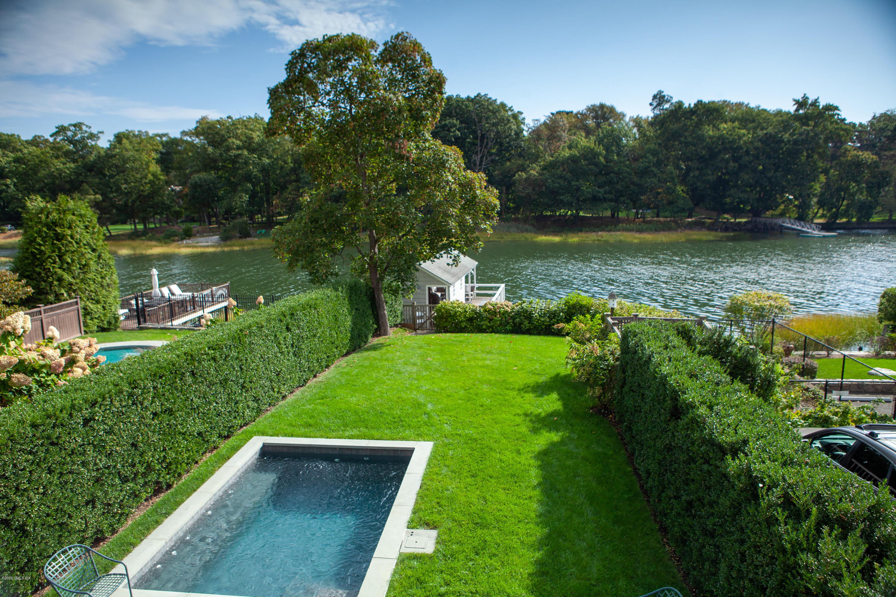 619 Steamboat Road Greenwich, CT 06830 - Photo 18 of 27 a view of a lake with a yard