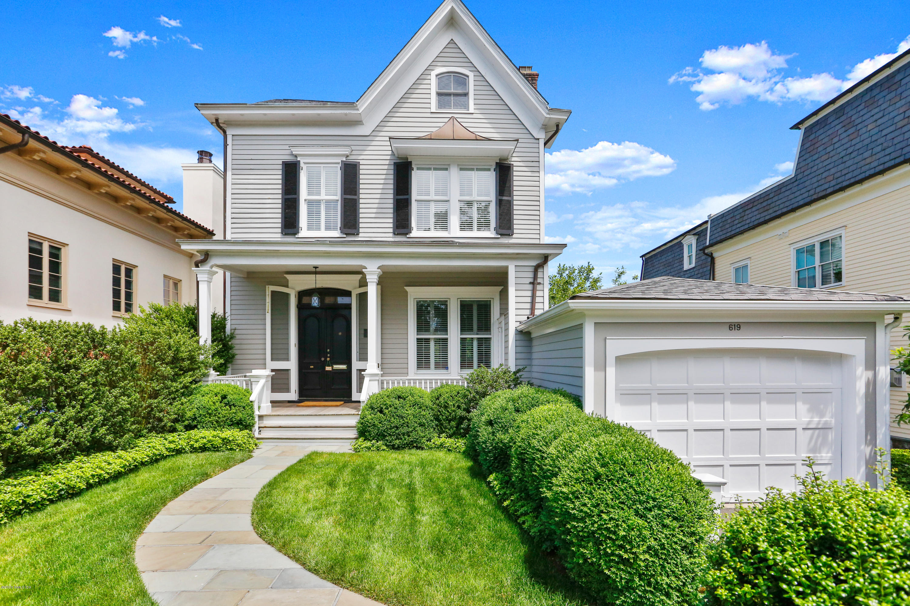 619 Steamboat Road Greenwich, CT 06830 - Photo 2 of 27 front view of a house with a yard