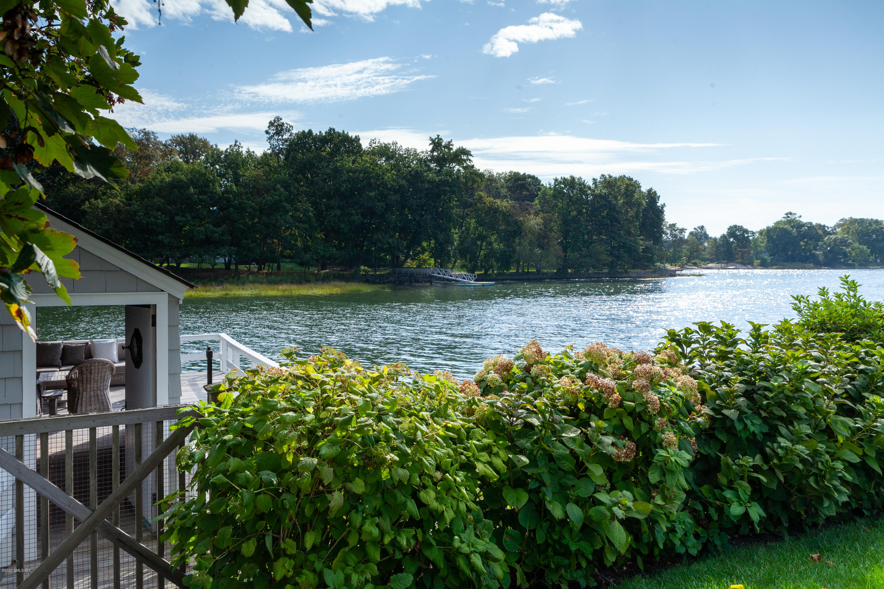 619 Steamboat Road Greenwich, CT 06830 - Photo 21 of 27 a view of a lake with a big yard