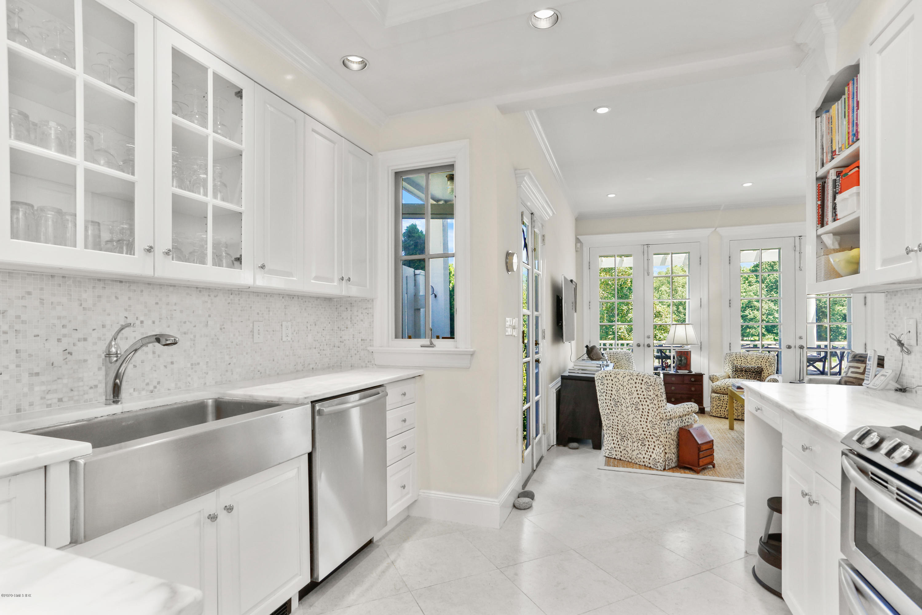 619 Steamboat Road Greenwich, CT 06830 - Photo 7 of 27 a large white kitchen with cabinets