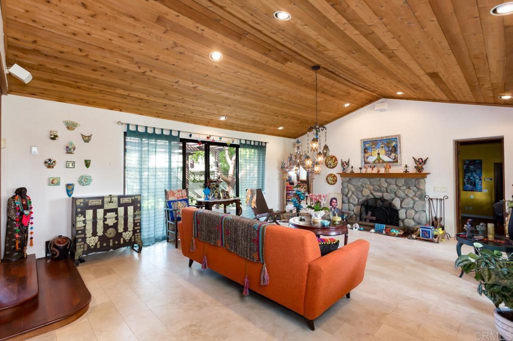 1249 Melba Road Encinitas, CA 92024 - Photo 11 of 47 a living room with fireplace furniture and a flat screen tv