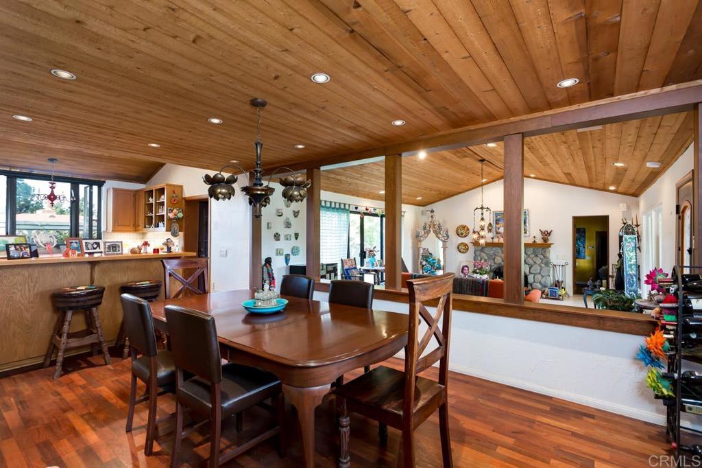 1249 Melba Road Encinitas, CA 92024 - Photo 15 of 47 a view of a dining room with furniture and wooden floor