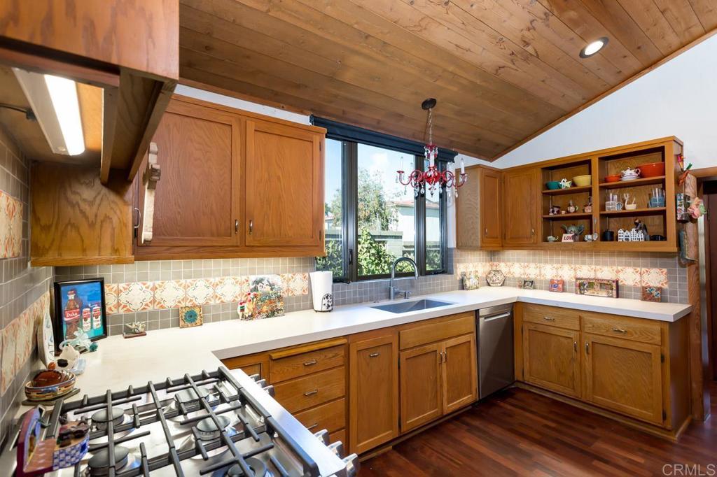 1249 Melba Road Encinitas, CA 92024 - Photo 24 of 47 a kitchen with a sink stove and cabinets