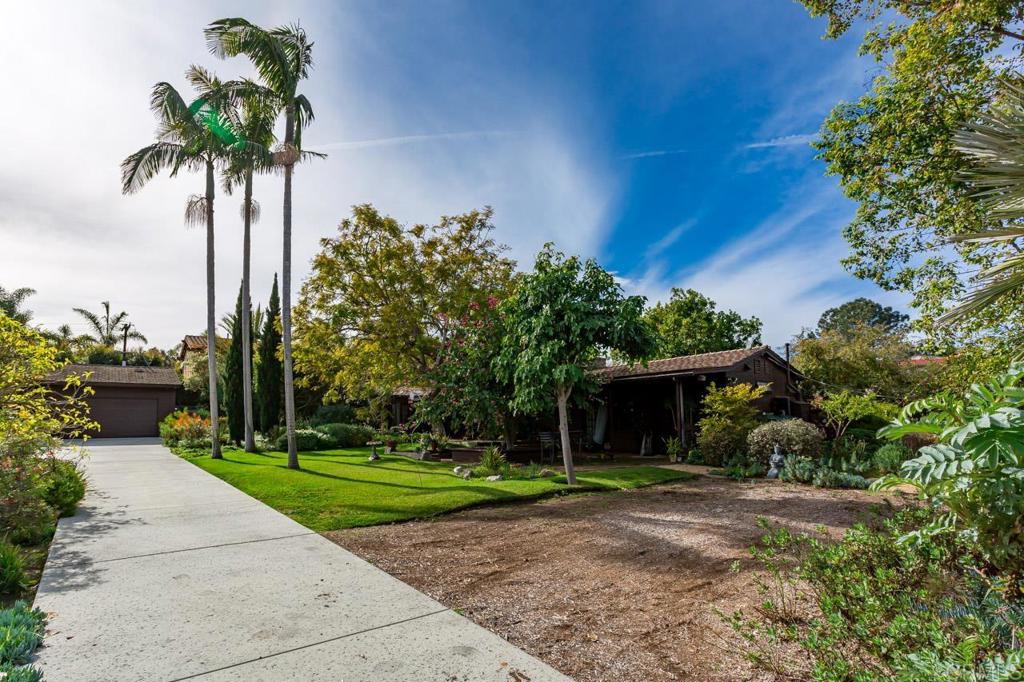 1249 Melba Road Encinitas, CA 92024 - Photo 35 of 47 a front view of a house with garden