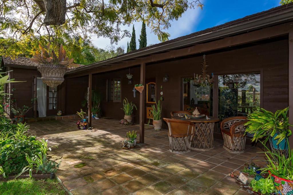 1249 Melba Road Encinitas, CA 92024 - Photo 7 of 47 a view of a patio with table and chairs and potted plants