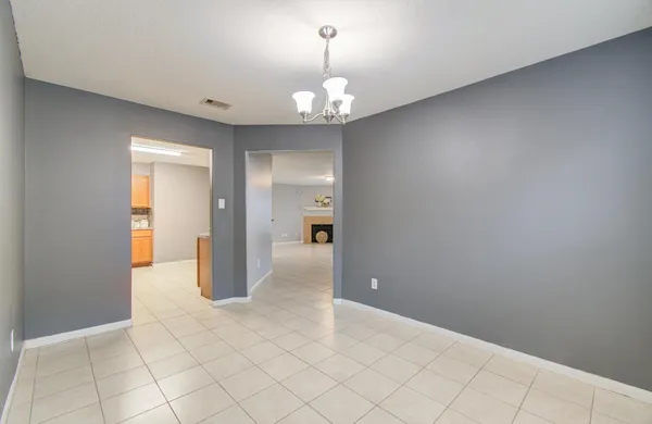 a view of an empty room and a bathroom
