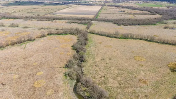 a view of a lake with a big yard