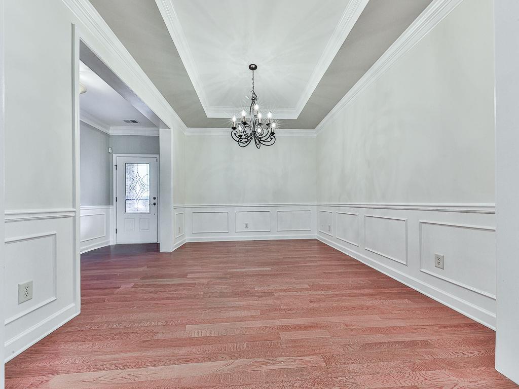 626 Laurel Crossing Canton, GA 30114 - Photo 12 of 77 wooden floor in an empty room with a window