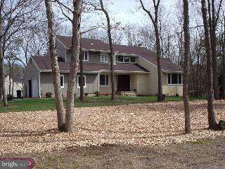 406 Indian Mills Road Shamong, NJ 08088 - Photo 1 of 1 a front view of a house with a yard