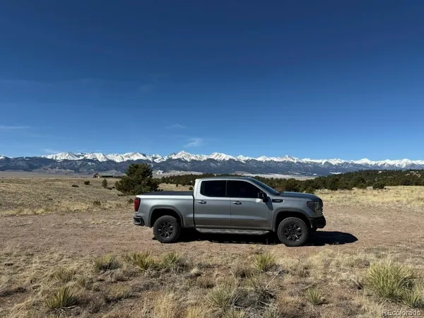 a view of a car parked on the side of a lake