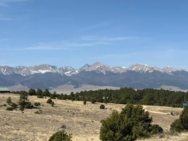an aerial view of mountain with an outdoor space