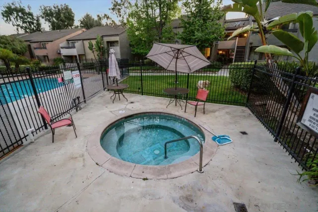 an outdoor space with seating area and garden