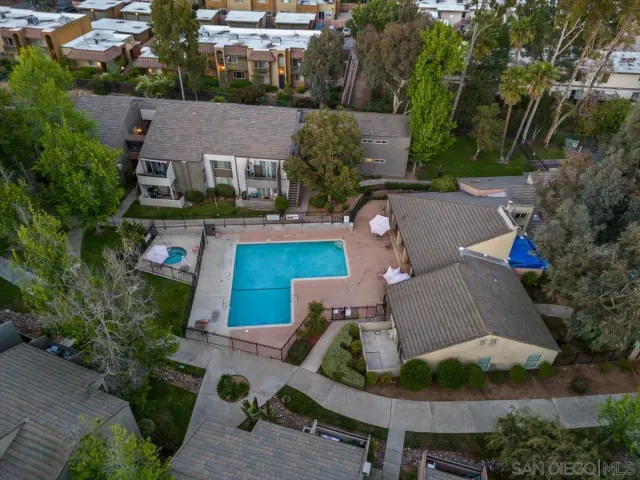 an aerial view of a house with garden space and street view